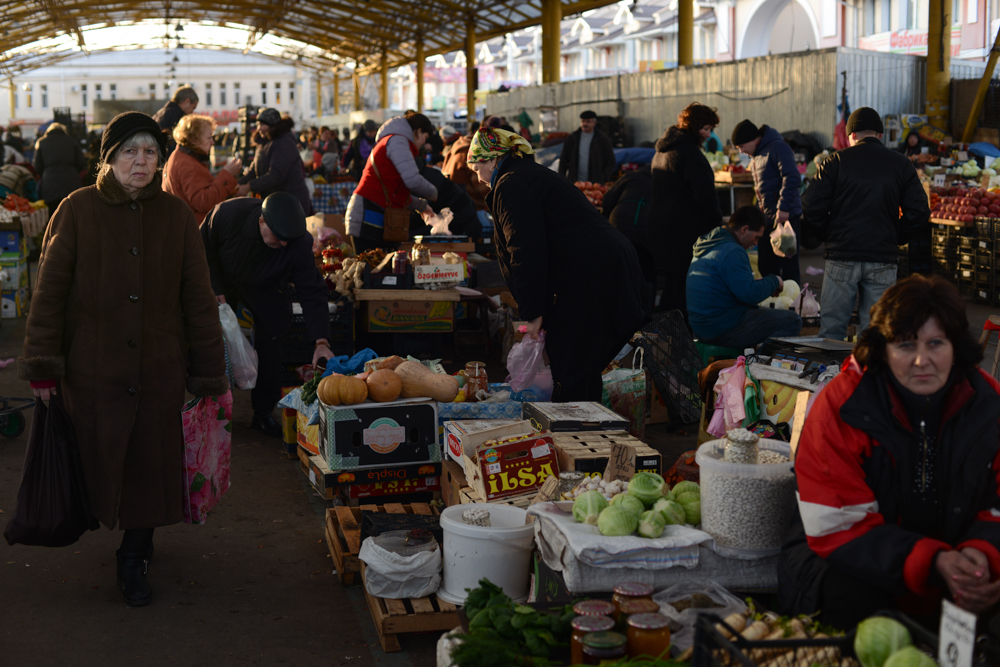 ODESSA, UKRAINE.  Vendors and customers in the vegetable and fruit pavilion at the large Privoz market on February 17, 2016.