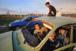 REYHANLI, TURKEY.  Syrian children play in a junkyard of old, abandoned and destroyed vehicles at the entrance to the Reyhanli tent city on February 26, 2012.  As the year old rebellion against the rule of Bashar Al-Assad continues just across the border in Syria, Turkey has seen a continued influx of refugees from the Syrian conflict but has not granted them refugee status and instead considers them to be {quote}guests{quote} of Turkey, the sign of another conflict fissure located precariously close to the pipeline route.
