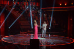BELGRADE, SERBIA.  (At left) Lepa Brena, one of the oldest and original turbofolk stars, during a performance on the set of {quote}Zvezde Granda,{quote} or {quote}Grand Stars,{quote} a premier turbofolk showcase on Serbian television station TV Prva, on July 1, 2015.  During this particular taping of {quote}Grand Stars,{quote} well known stars are singing with younger, lesser known stars with the goal of elevating their personality in public life.
