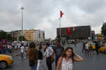 ISTANBUL, TURKEY.  A woman walks through Taksim Square just before the start of Ramadan at sundown on July 9, 2013.  Since demonstrators occupied the adjacent Gezi Park for two and a half weeks last month, police have maintained a heavy presence in Taksim Square and periodic clashes have erupted as demonstrators have returned to the square in protest of Prime Minister Recep Tayyip Erdogan.