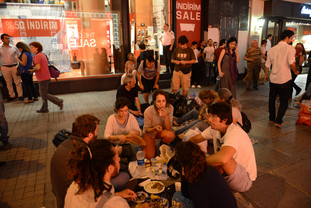 ISTANBUL, TURKEY.  People gather for Iftar dinner on newspapers on Istiklal Street in a show of solidarity with the demonstrators that had previously occupied Gezi Park at the start of Ramadan on July 9, 2013.  Since demonstrators occupied Gezi Park for two and a half weeks last month, police have maintained a heavy presence in Taksim Square and periodic clashes have erupted as demonstrators have returned to the square in protest of Prime Minister Recep Tayyip Erdogan.