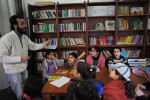 DIYARBAKIR, TURKEY.  Children study Kurdish language and culture and are instructed on their rights by a teacher at the Astrid Lindgren Children's Literature and Culture Center on February 25, 2012.  After nearly a century of forced assimilation policies in Turkey, many Kurds are standing up for their culture and language in a renewed bid for cultural, if not political, independence.