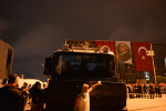 ISTANBUL, TURKEY.  A protester poses in front of a Turkish-made TOMA riot control vehicle in Taksim Square the evening after riot police moved to retake the square the night before on June 12, 2013. After 11 days of protest and occupying Gezi Park adjacent to Taksim Square, riot police firmly took control of Taksim Square with street battles on back streets occurring until the early hours of the morning and a few hundred demonstrators continuing to camp out in the adjacent Gezi Park.