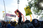 ISTANBUL, TURKEY.  Flags bearing Abdullah Ocalan, the jailed PKK leader, and the Kurdish national flag are seen in the middle of Taksim Square on an overturned police vehicle during a protest of the Prime Minister Recep Tayyip Erdogan and his policies a week after demonstrators forced police to withdraw from the square leading to a carnival-like sit-in on June 8, 2013. A week of protests led to police being barricaded out of and withdrawing from Istanbul's Taksim Square as it transforms increasingly into a free zone; the crisis, which began over construction of a park and plans to reconstruct Ottoman barracks and a shopping mall, has evolved into Turkey's biggest political crisis in decades as Turks express frustration with the current AK Party, Justice and Development Party and Prime Minister Recep Tayyip Erdogan.