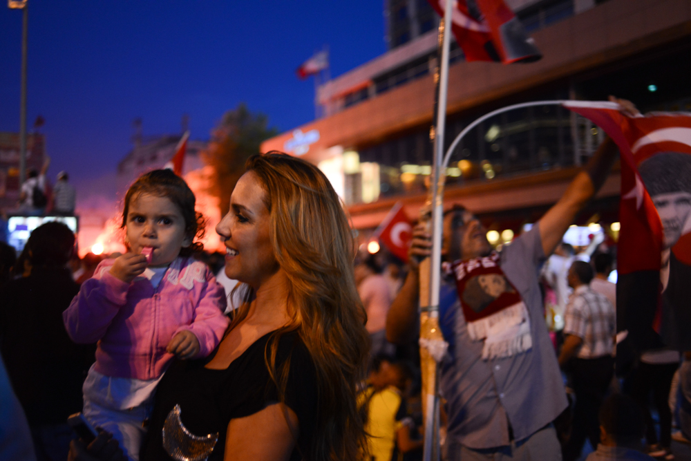 ISTANBUL, TURKEY.  Turks gather in Taksim Square where ongoing protests against the Prime Minister Recep Tayyip Erdogan and his policies a week after demonstrators forced police to withdraw from the square have lead to a carnival-like sit-in on June 8, 2013. A week of protests led to police being barricaded out of and withdrawing from Istanbul's Taksim Square as it transforms increasingly into a free zone; the crisis, which began over construction of a park and plans to reconstruct Ottoman barracks and a shopping mall, has evolved into Turkey's biggest political crisis in decades as Turks express frustration with the current AK Party, Justice and Development Party and Prime Minister Recep Tayyip Erdogan.