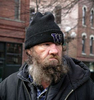 A homeless man named Daniel panhandles early one morning in Pioneer Square. Monday, Feb 27, 2006. Photo by Ron Wurzer 