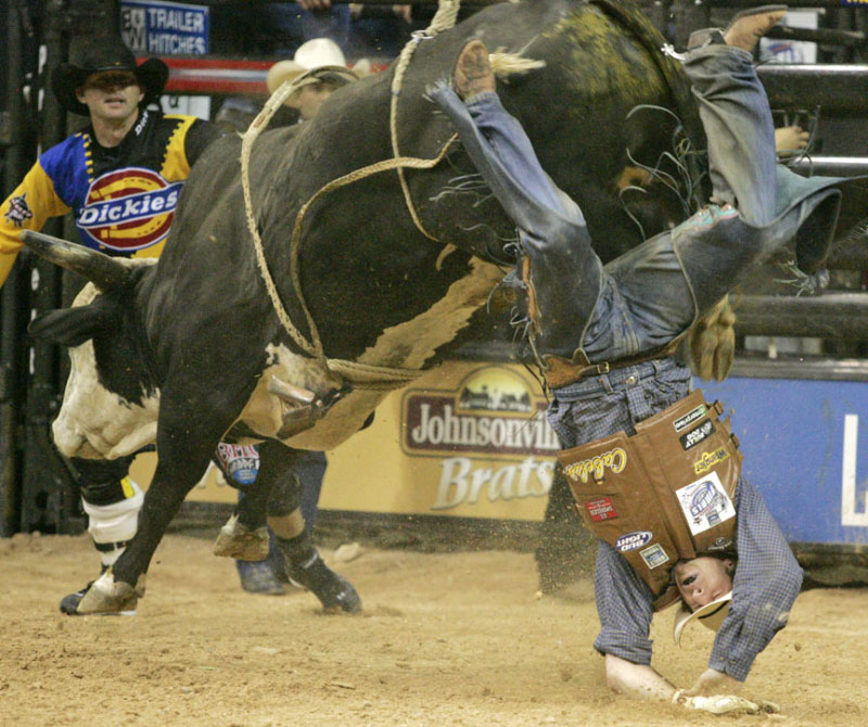 Ned Cross, of Midland, Oregon, gets bucked from Jack Hammer during a re-ride at the sixth round of Professsional Bull Riders World Finals at Thomas & Mack Center Saturday, Nov. 3, 2007.