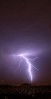 Lightning strikes over the northeast portion of the Las Vegas.