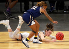 UC Davis’ Mackenzie Trpcic (00) and UC Irvine’s Haleigh Talbert (21) go after a loose ball during the first half of an NCAA college basketball game in the championship of the Big West Conference tournament.