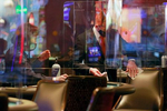 Staff sanitize a table game area between game play at the reopening of Bellagio hotel-casino Thursday, June 4, 2020, in Las Vegas. (Photo by Ronda Churchill/AFP)