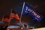Donald Trump supporter and Las Vegas resident Maryann, last name withheld, holds a Trump flag and protests outside Clark County Election Department November 6, 2020, in North Las Vegas. (Photo by Ronda Churchill/AFP)