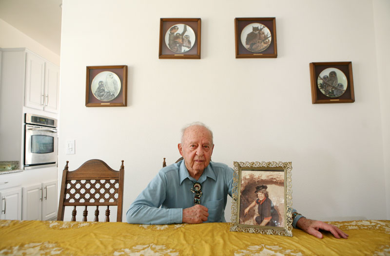 Edward Zajac, 94, sits with a photograph of his wife Agnes at this daughter’s home in Henderson, Nevada. Upon his wife’s death in 1981, he commissioned a statue of St. Ambrose, in her memory, which was erected at the St. Ambrose Catholic Church in Salt Lake City. The statue was recently stolen and soon recovered after the story ran.