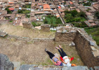Woman sunbathe on the Pinkaylluna Incan ruins Wednesday, Feb. 19 2014, in Ollantaytambo, Peru.