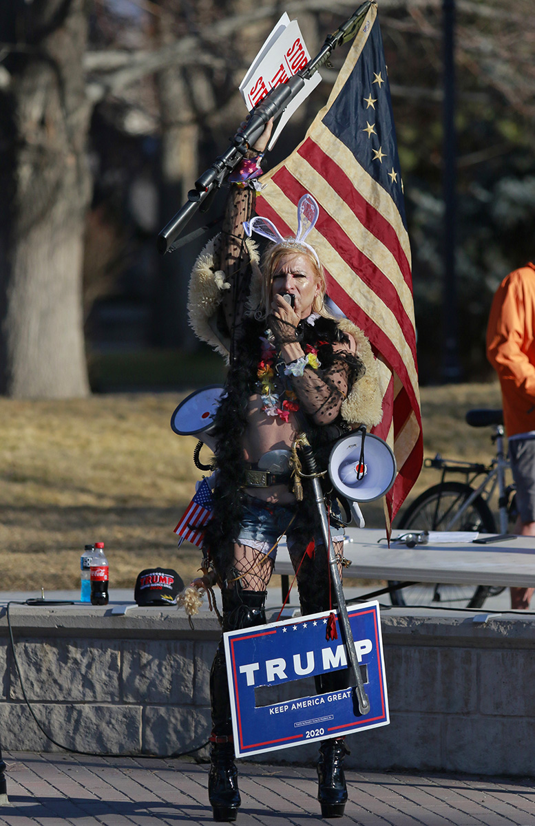 A Trump supporter that goes by {quote}Cowgirl Barbie{quote} sings lyrics from Tom Jone's {quote}What's New Pussycat{quote} and calls out Democrats as she protests with a small grou outside Nevada State Legislature in Carson City.