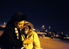 Volunteer Liestela Lee, left, hugs Kathy Washington under a streetlight during a feed the homeless and needy gathering on the corner of McWilliams Avenue and G Street. Washington suffers from bone cancer and could not to eat. She was there to visit a priest. Different squadrons at Nellis Air Force base, community members, and special interest groups gathered to feed those in need. 