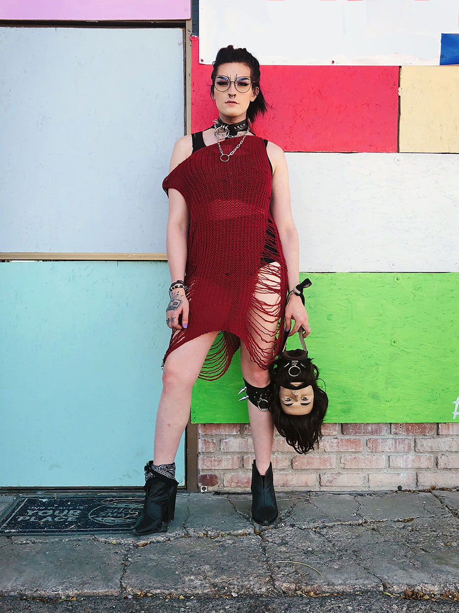 A transwoman that goes by the name Zaylien Zakkota stands for a portrait in the arts district. She made her purse, which often turns a few heads.