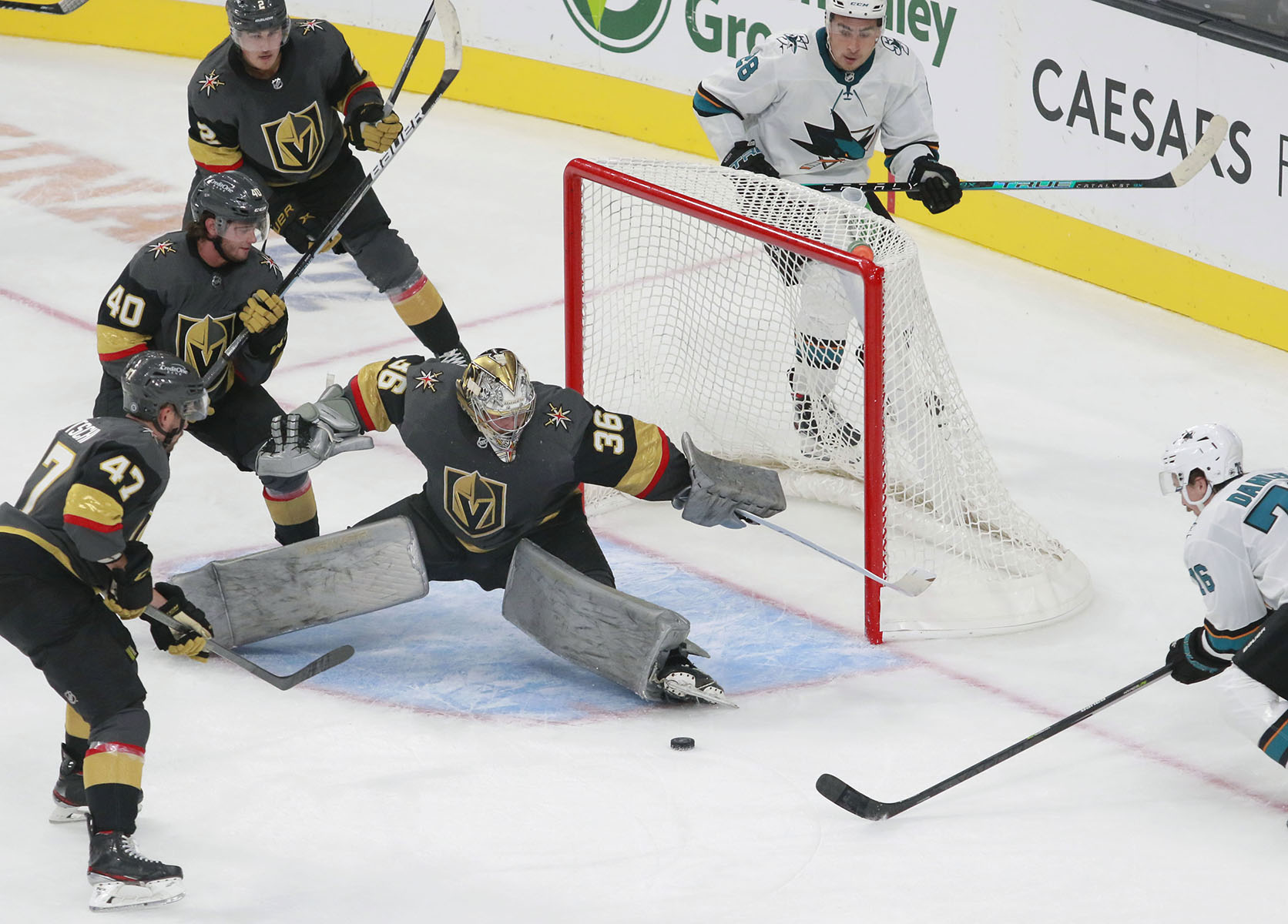  Vegas Golden Knights goaltender Logan Thompson (36) saves a shot in the third period of an NHL hockey preseason game against the San Jose Sharks.