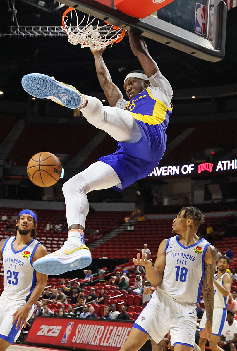 Golden State Warriors guard Daeqwon Plowden (29) slam-dunks the ball during a NBA Summer League game against Oklahoma City Thunder Friday, July 19, 2024, in Las Vegas.