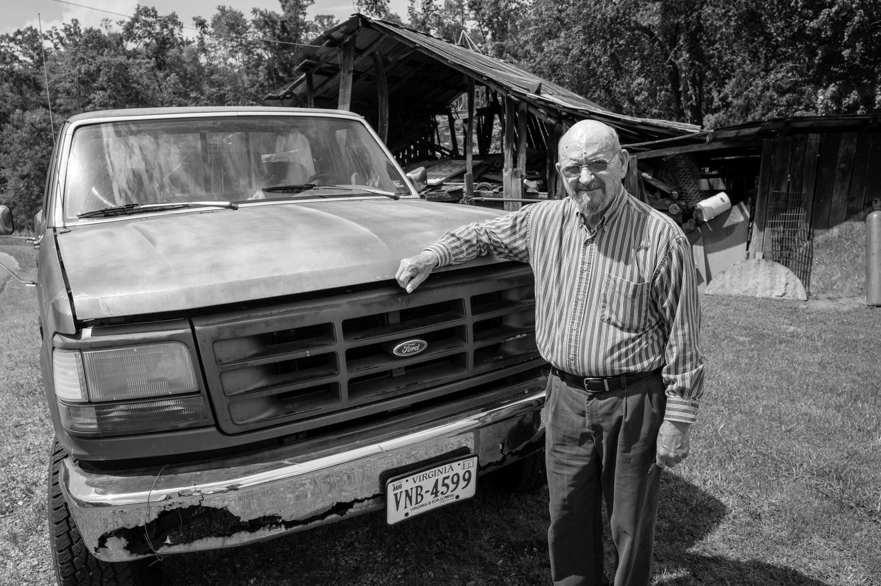 Tarncy Mullins, former coal miner, with the 1972 truck he still drives, Clintwood, VA. 