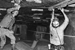 Coal miners including Gary Nickles, right, shore up the ceiling with supports to prevent a cave-in. Elkin mine #6, Norton, VA, 1978. Jon Chase photo