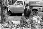 Okey Dotso tends a roadside farm stand while children play in the truck cab behind, in Comfort, WVA, 1978. Comfort is a census-designated place in Boone County with a population of 225. Jon Chase photo