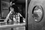 Woman barkeeper thinking of other places, West Virginia, 1978. At one point, more than 100,000 West Virginians worked in the mines that produced well-paying jobs. Now there are fewer than 20,000, and the jobs that do exist pay far less than they used to, thanks to successful anti-union actions by coal companies. Coal counties in Appalachia suffer high rates of heart disease, obesity, smoking, diabetes, and opioid abuse, leading them to have some of the lowest life expectancies in the country.  Jon Chase photo