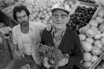 Bobby Comeau, owner of Bobby's Fruit, with his right-hand man, ninety-year old Louis Picariello. {quote}Working here keeps me active, keeps my legs moving. At home, I'd just sit and nap, or smoke my cigar. Here at the store, everybody knows my name. And working with Bobby...he's like a grandson. You know, I enjoy it more here  than at home. But don't tell my wife!{quote}Louis Picariello