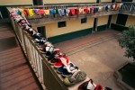 Children's shoes line the balcony as they dry in the sun, at the Children's Welfare Institute in Hefei.