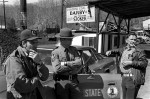 Miners pass the time with a state trooper during coal strike.