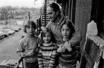 Resident Jim Cooke, actor, with his triplets on the fire escape outside his apartment.{quote}It's always unspoken, that if anyone needs anything, people are there. Like when my neighbor went back to work at night after being divorced, her kids slept over at our house three times a week. I'd get them up and off to school in the morning...that went on for at least a year. You've got the best of communal living, but you have your own space, and you can always close the door.{quote}Linda Finucane Bell, tenant and single parent