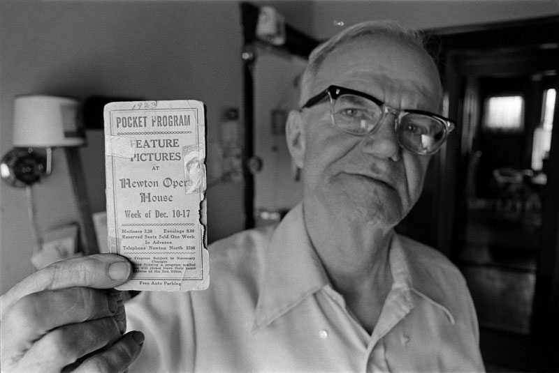 Tenant John McDonald with his 1923 pass to the Newton Opera House, where he worked for forty-four years until it was demolished.
