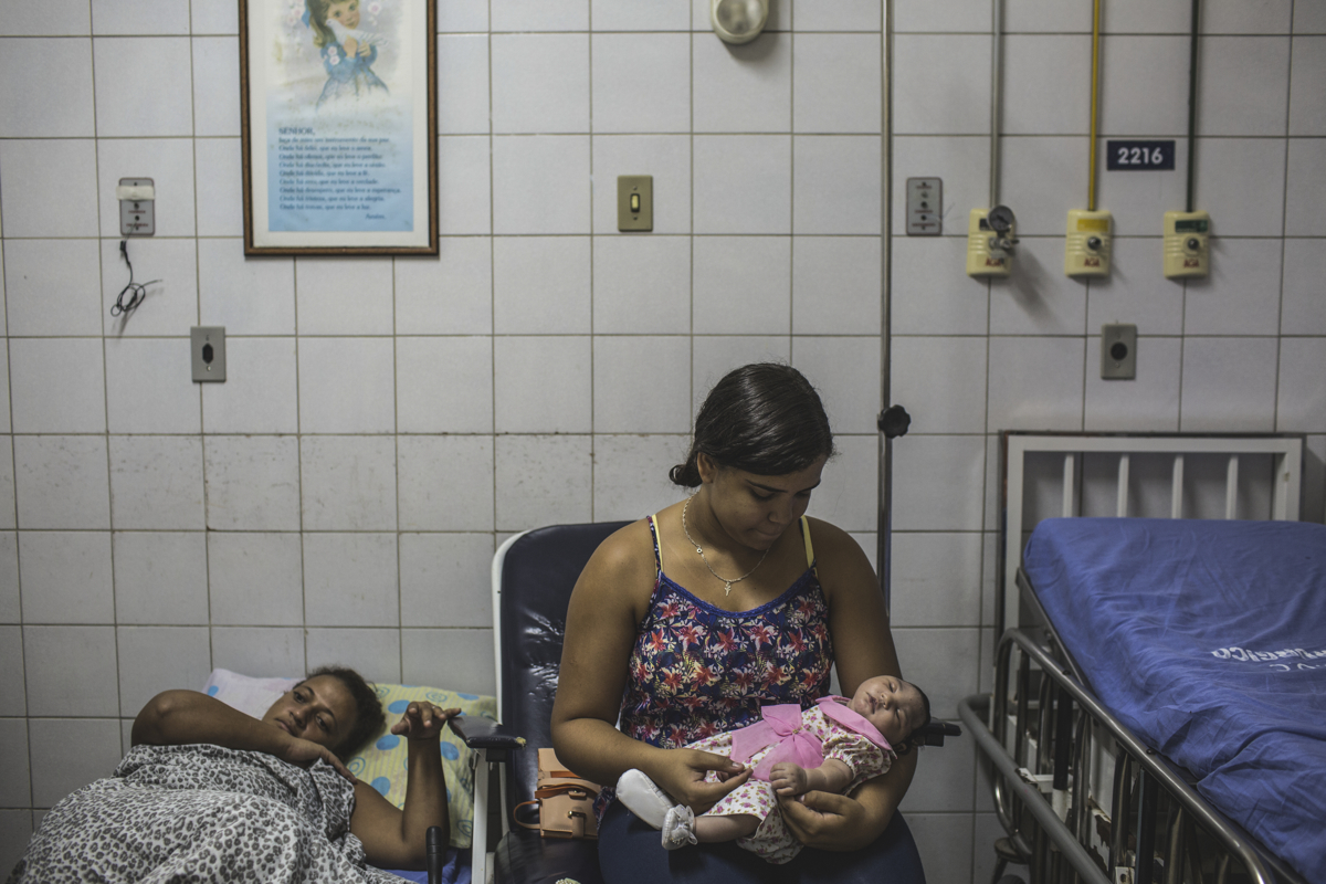 JANUARY 8, 2016 -- Cleane Silva, 18, holds one-month-old Duda who was born with zika-related microcephaly, at the University Hospital of Oswaldo Cruz where the newborn recovers from severe malnutrition, in Recife. Cleane's mother-in-law, Mirian Pereira, became guardian of Duda when the baby was abondoned at birth by her brother and his wife at the maternity hospital.
