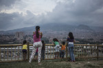 Residents take in the view at the top of the {quote}hill{quote}, the area of a new garden. Since 2012, the city of Medellin began an innovative project in the neighbourhood of Moravia to transform the city’s main garbage dump into a sustainable garden where 50 thousands residents lived. 