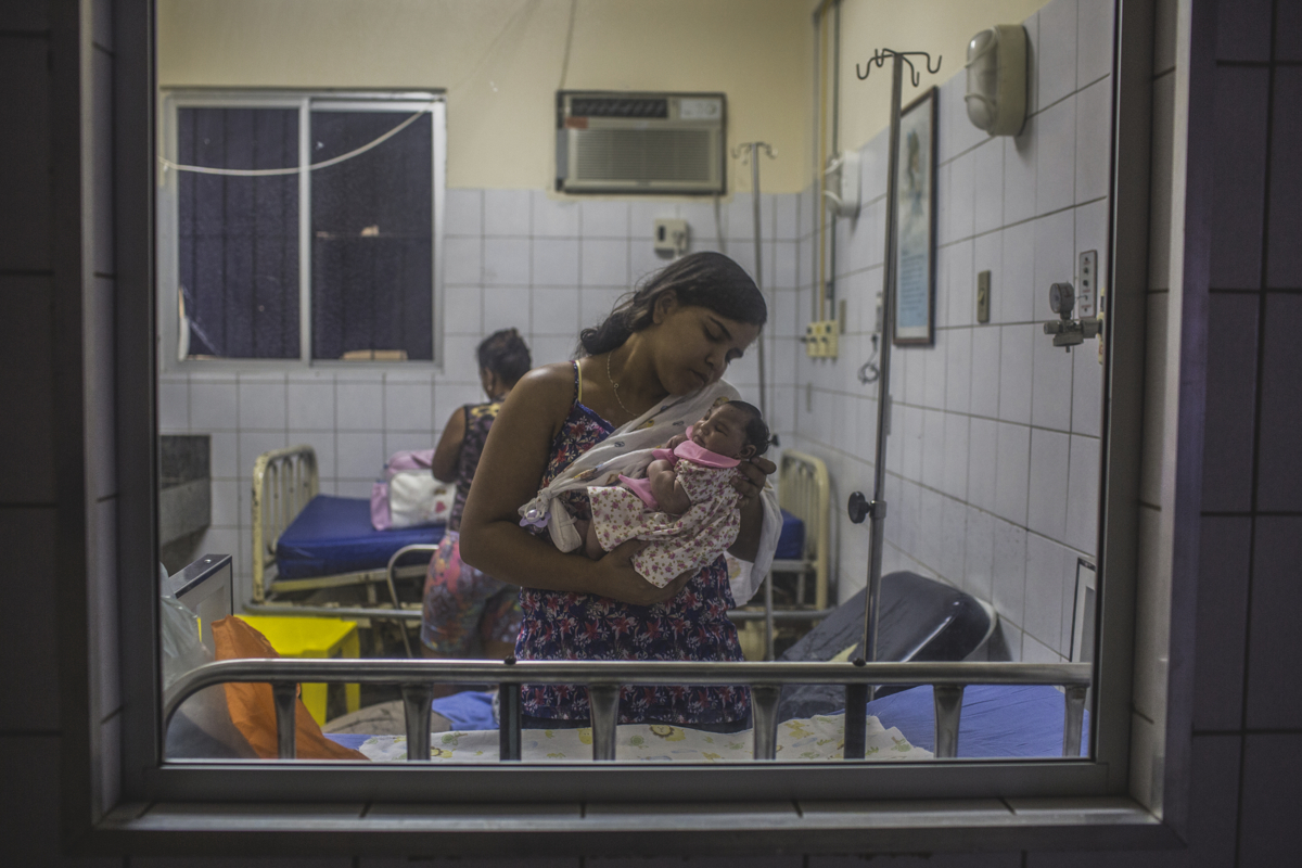 JANUARY 8, 2016 -- Cleane Silva, 18, holds Duda at the University Hospital of Oswaldo Cruz. Cleane and Mirian rescued the newborn who was abandoned at birth by her brother and his wife at the maternity hospital.