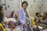 JULY 25, 2016 -- Dr. Regina Coeli, director of children's infectious diseases, checks in on Duda, now eight-months-old, with Cleane and Mirian, at the Oswaldo Cruz University Hospital. Duda was hospitalized for a lung infection created by complications from seizures. She hasn't been able to swallow food, so doctors placed a food tube in her. Duda has been hospitalized every month since she was born as her caregivers and doctors discover new health issues. According to doctors, Duda has one of the worse cases of zika-related microcephaly. 