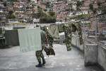 An army unit stationed in Comuna 13, the most dangerous district in Medellin, Colombia. There are eight bases with 140 soldiers in the district. In 2006, the city built a public library, a new school, public green spaces, and improved access to transportation through a cable car line and escalators connecting the neighbourhoods to the metro and the city. 