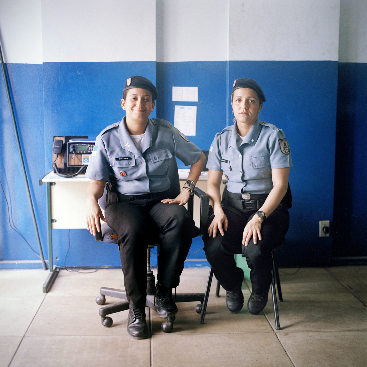 Police officers Marceba Gomes, 29, left, and Ana Carolina Braz, 32, right, dispatch of the Pacifying Police Unit (UPP), in Complexo do Caju, Rio de Janeiro, Brazil.