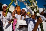 Brazilians celebrate their annual tribute to Yemanja, the goddess of the sea in the Afro-Brazilian religion Candomble, offering flowers, food and perfume, as drums belted out African rhythms, during a pre-Carnival celebration in Rio de Janeiro, Brazil, Saturday, Feb. 2, 2013.