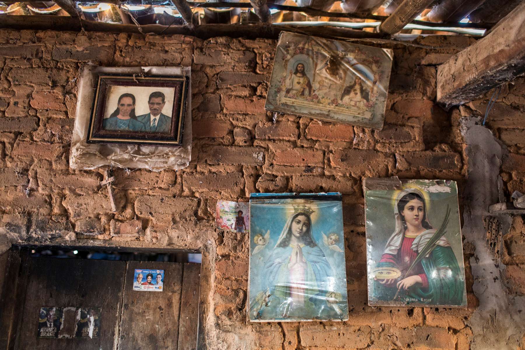 Campo Alegre de Lourdes, Brazil. Saturday, Nov. 14, 2015.A young portrait of Severiana Maria de Jesus, 75, and Pedro Jesus dos Santos, 89, hangs on the wall of their brick home, in their homestead near Campo Alegre de Lourdes, in the state of Bahia, on Wednesday, July 22, 2015. Senhor Pedro's father built their three-room home from mud and sunbaked bricks. \Severiana and Pedro, subsistence farmers, face a daily struggle. Their only source of water is a pond. They were not aware of the federal water program that delivers potable water for free. The cycle of poverty that exists for nearly 1/3 of the regional population is a major social inequality issue in which poor families stay impoverished for generations.