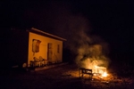 Passagem, Brazil. Saturday, Feb. 13, 2016. Burning trash to keep the mosquitos away outside a home in Passagem, a fishing village along the São Francisco River.