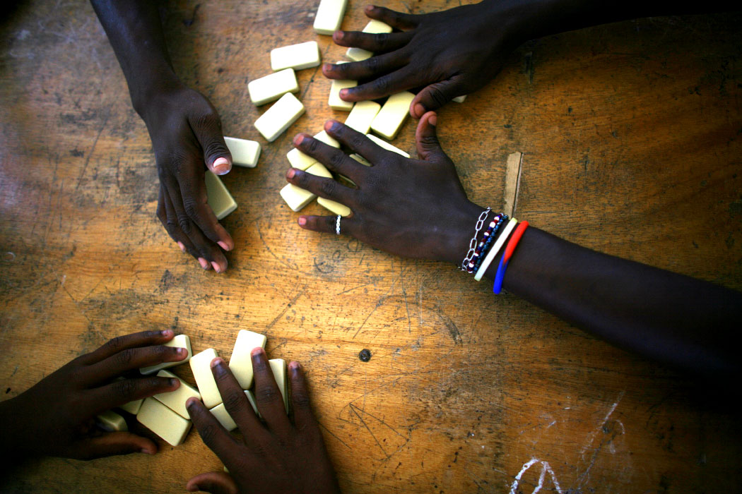 A favorite pastime for the boys in the Project Esperanza boys' home is dominos.  Theirs is an animated form in which they violently slap the table with their pieces in a round that leaves a loser with clothespins pinching his face until he can win again.