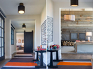 This is a montage of two photos taken in a hallway in a mountain modern residence. The hallway is loing with a carpet of orange, cream and brown striping and at one end of one photo is the living room with a custom steel fireplace and at the end of the other photo is a barn wood door on rollers and the tv room with couches and a center table.