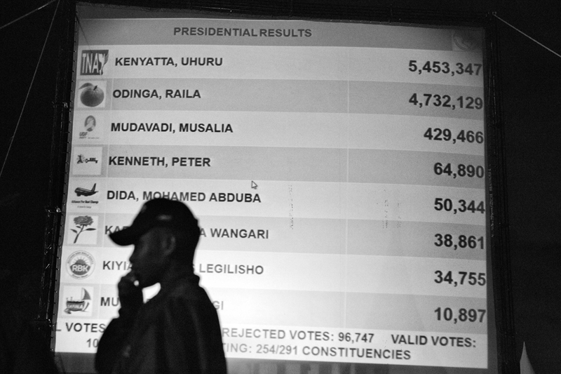 At Bomas of Kenya live television broadcasts of preliminary results of he presidential election were displayed on a large screen.