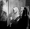 Women from all walks of life line up to vote in Libya's historical Parliamentary Election following their revolution.