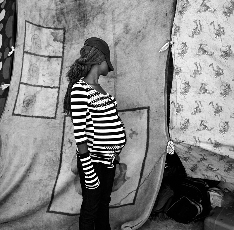 Bridget, 24, who is 6 months pregnant and originally from Nigeria has lived in Libya for the past four years. She came to Libya because she explained “there was no money in my country. I came here and sold clothes. There is better money here in Libya. I don’t want to go home to Nigeria, I would like to go to Italy.” Currently, Bridget is living at Janzour Port underneath a dry docked boat and relying on the kindness and generosity of locals donating food and water. “I hope I leave before I have my baby, this is not a good place to be born.”