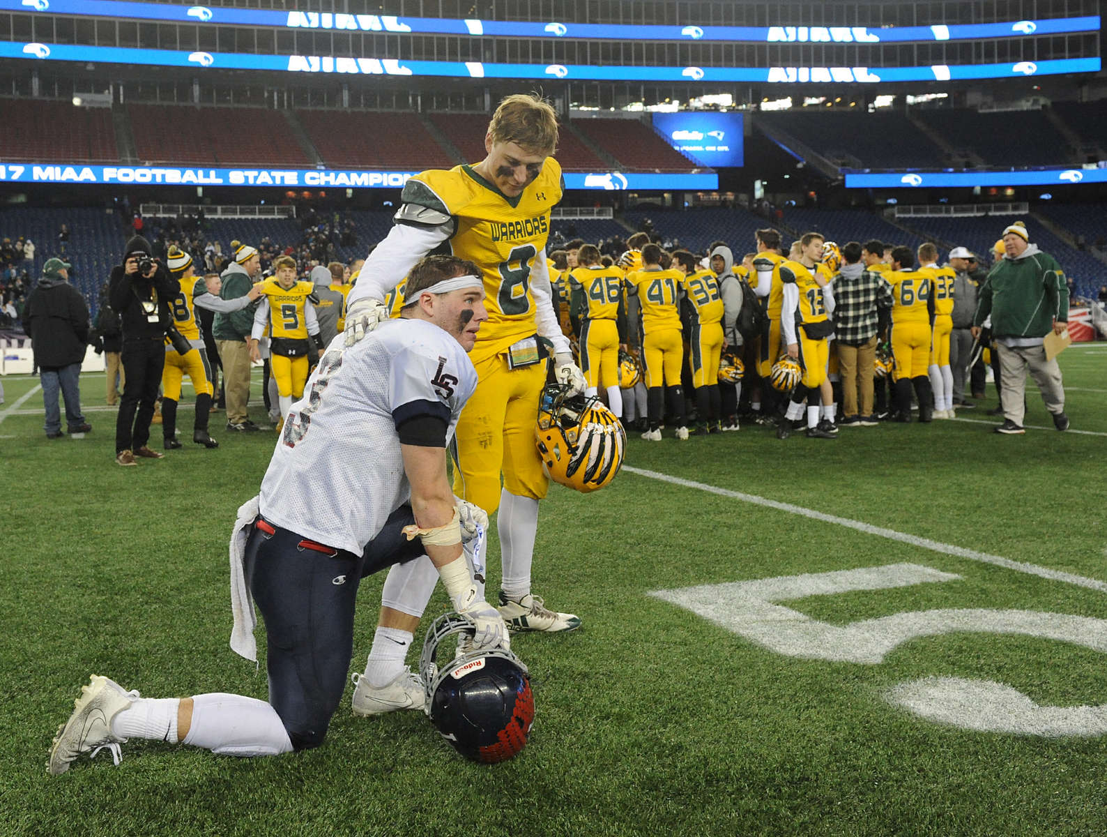 12/1/17-- FOXBORO--  Lincoln-Sudbury captain James Dillon is consoled by King Philip's Luke D'Amico at the conclusion of the MIAA Div. 2 State Championship at Gillette Stadium Friday night. King Philip won 10-7.  [Daily News and Wicked Local Staff Photo/Art Illman]