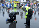 4/16/18-- FRAMINGHAM--   Framingham Police Officer Garrett Coffin checks on a runner at the 2018 Boston Marathon. [Daily News and Wicked Local Staff Photo/Art Illman]
