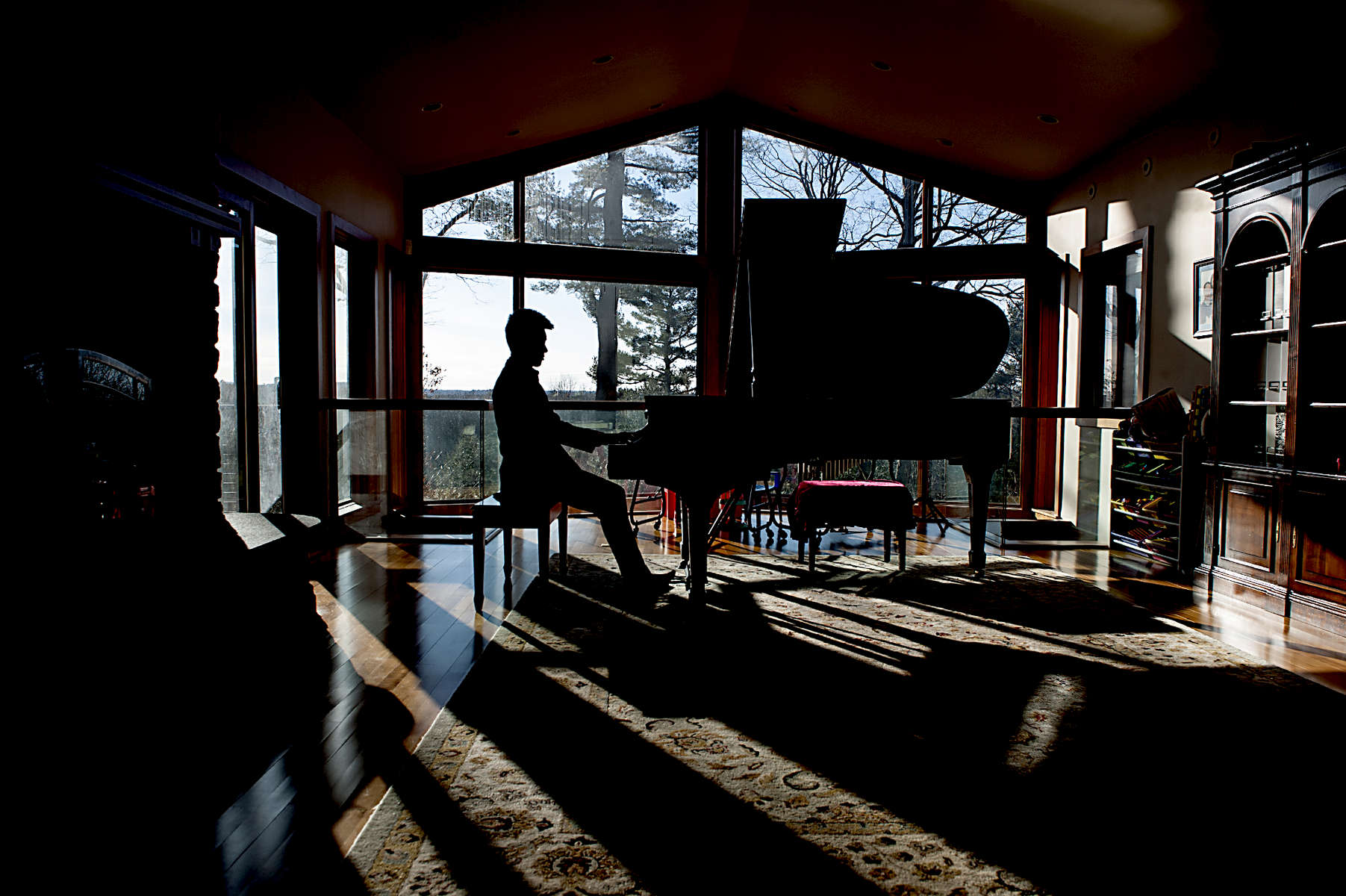 2/11/19-- WAYLAND-- Wayland High School junior Kyle Chen playing piano at home Monday. [Daily News and Wicked Local Staff Photo/Art Illman]\
