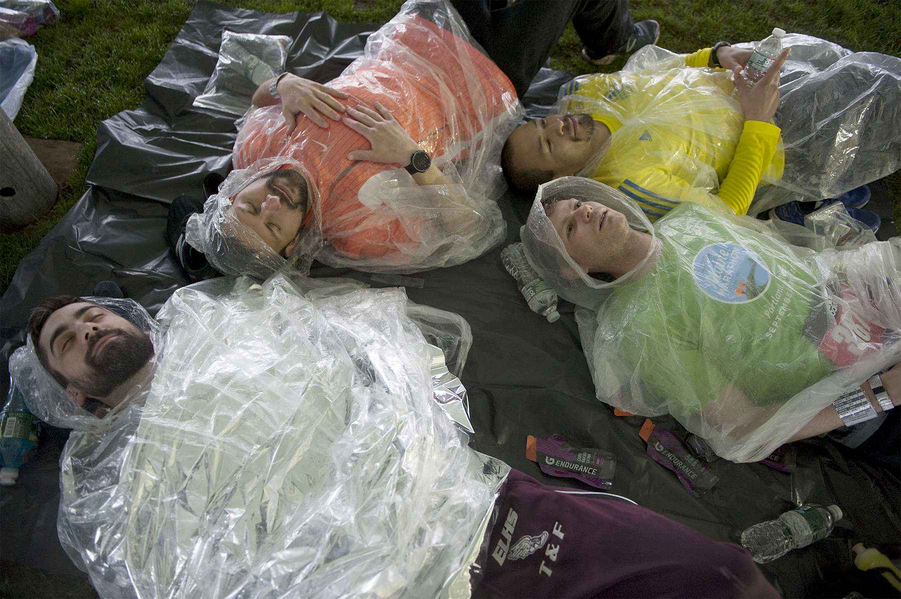 4/15/19--HOPKINTON-- Kyle Simmons, Dan Pontbriand, Alan Groudle, and Andrew Kephart, all of Maine, were hunkered down in the  Boston Marathon Runner's Village Monday morning. [Daily News and Wicked Local Staff Photo/Art Illman]