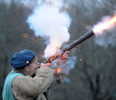 4/19/17-- SUDBURY-- Eric Vollheim, who joined the Sudbury Companies of Militia and Minute in the 1960s as a Boy Scout, fires his musket in front of Sudbury Town Hall, on Patriots' Day, April 19, 2017, the 242nd anniversary of the Battles of Lexington and Concord and the start of the American Revolution. [Daily News and Wicked Local Staff Photo/Art Illman]